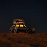Josh-Walker-with-a-James-Baroud-Evasion-under-a-starry-sky-scaled